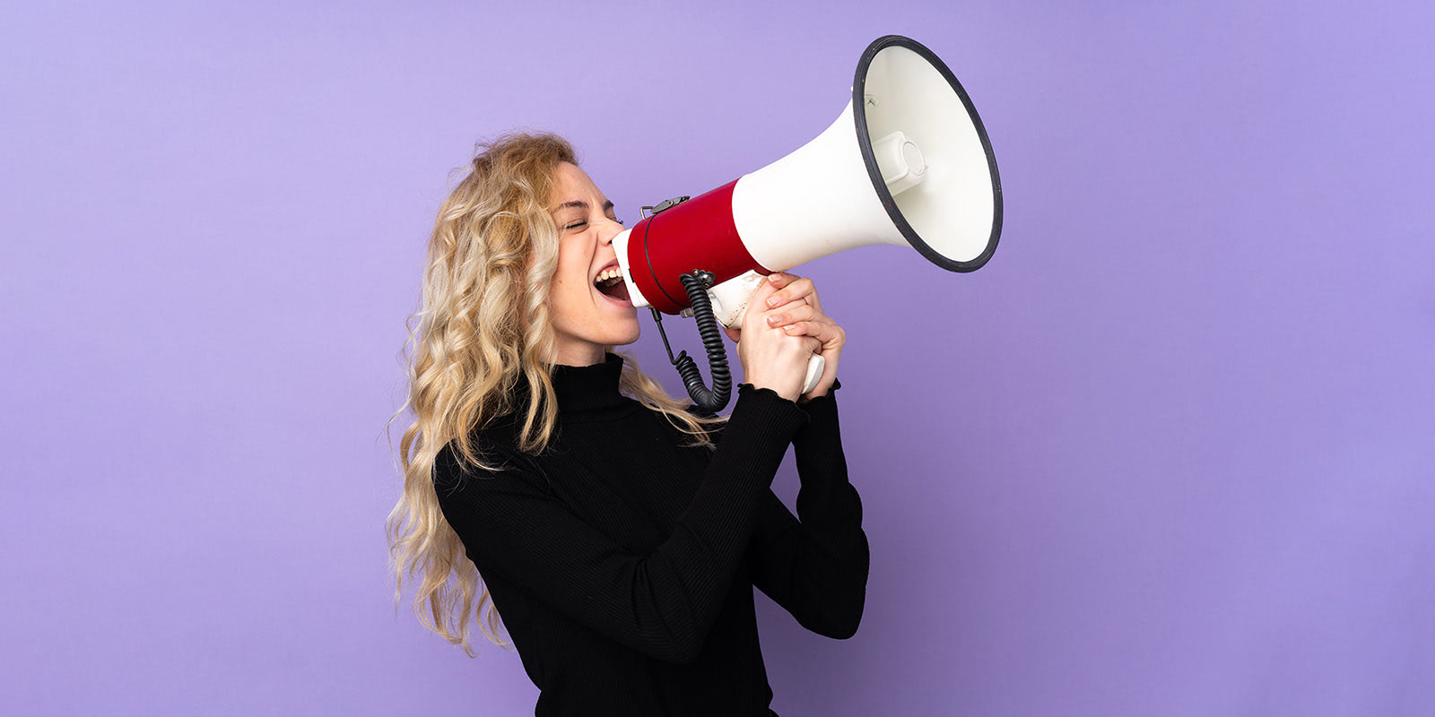 A person shouts through a megaphone.